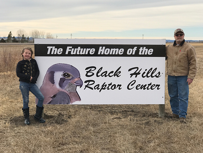 Photo of the future home of the Black Hills Raptor Center showing fence, green pasture and trees, for the Marco's Pizza Pizza Fund Raiser
